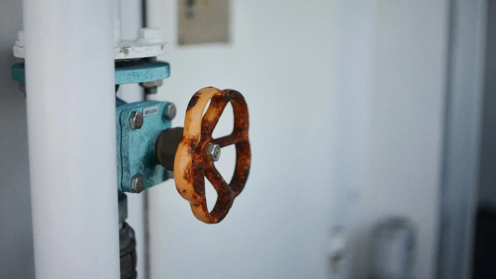 A water shut-off valve on a supply pipe, of the type used to isolate a house in an emergency